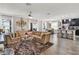 Spacious living room with L-shaped sofa and hardwood floors at 2720 Monticello Way, Kissimmee, FL 34741
