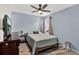 Bedroom with light blue walls and ceiling fan at 2720 Monticello Way, Kissimmee, FL 34741