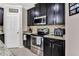 Well-equipped kitchen with dark wood cabinets at 2720 Monticello Way, Kissimmee, FL 34741