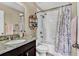 Clean bathroom with granite countertop, bathtub, and shower at 2720 Monticello Way, Kissimmee, FL 34741