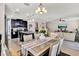 Open concept dining room with kitchen view at 2720 Monticello Way, Kissimmee, FL 34741