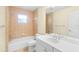 Bathroom boasts a bathtub, toilet and updated vanity at 1955 Avenue D, Mulberry, FL 33860