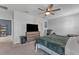 Comfortable main bedroom with king-size bed, ceiling fan and large windows at 2557 Shamrock St, Tavares, FL 32778