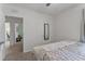 Main bedroom with large bed and access to another room at 2557 Shamrock St, Tavares, FL 32778