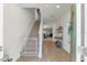 Bright entryway with staircase and view into living area at 2557 Shamrock St, Tavares, FL 32778