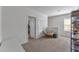 Spacious loft area with a comfy chair, built in shelving, and natural light at 2557 Shamrock St, Tavares, FL 32778