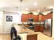 Modern kitchen with granite countertops and stainless steel appliances at 1402 Wexford Way, Davenport, FL 33896
