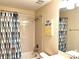 Clean bathroom with a shower/tub combo and cheerful decor at 1402 Wexford Way, Davenport, FL 33896
