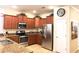 Well-equipped kitchen, stainless steel appliances and granite countertops at 1402 Wexford Way, Davenport, FL 33896