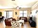 Comfortable living room with leather sofas and a large TV at 1402 Wexford Way, Davenport, FL 33896