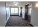 Building hallway with elevators and carpeting at 7395 Universal Blvd # 904, Orlando, FL 32819