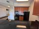 Full kitchen with dark wood cabinets and black appliances at 7395 Universal Blvd # 904, Orlando, FL 32819