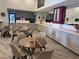 Community lounge with tables and chairs at 7395 Universal Blvd # 904, Orlando, FL 32819