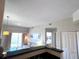 Open concept kitchen with breakfast bar and living area view at 7395 Universal Blvd # 904, Orlando, FL 32819