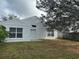 Private backyard with a patio, wood fence, and open lawn at 2518 Hickory Oak Blvd, Orlando, FL 32817