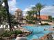 Resort-style pool with a waterslide and plenty of lounge chairs at 3001 Calabria Ave, Davenport, FL 33897
