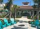 Community pool area with a fire pit and lounge seating at 5002 Tideview Cir # 3, Orlando, FL 32819