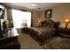 Spacious main bedroom with ornate bed and large window at 5002 Tideview Cir # 3, Orlando, FL 32819