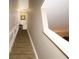 Elegant carpeted staircase with white railings leading to the upper level at 5002 Tideview Cir # 3, Orlando, FL 32819