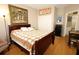 Cozy bedroom with a queen-size bed and hardwood floors at 5002 Tideview Cir # 3, Orlando, FL 32819