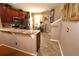 Granite countertops, stainless steel appliances, and custom cabinetry in this well-equipped kitchen at 5002 Tideview Cir # 3, Orlando, FL 32819