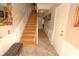 Elegant staircase with wood railings and tile flooring at 5002 Tideview Cir # 3, Orlando, FL 32819