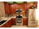Modern kitchen featuring stainless steel appliances and granite countertops at 5002 Tideview Cir # 3, Orlando, FL 32819