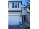 Two-story townhome with attached garage and paver driveway at 15121 Willow Arbor Cir, Orlando, FL 32824