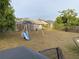 Large backyard with a swing set, grass, and a partial view of a fence at 2103 Pimlico St, Orlando, FL 32822