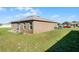 Large backyard with plenty of space for outdoor activities at 7878 Tanbier Dr, Orlando, FL 32818