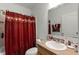 Clean bathroom with a shower/tub combo and updated vanity at 7878 Tanbier Dr, Orlando, FL 32818