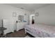 Bright bedroom with a queen bed, dresser, and large windows at 7878 Tanbier Dr, Orlando, FL 32818