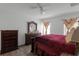 Spacious bedroom with a king bed and large dresser at 7878 Tanbier Dr, Orlando, FL 32818