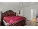 Main bedroom with a king-size bed and ensuite bathroom access at 7878 Tanbier Dr, Orlando, FL 32818