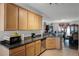 Kitchen with dark countertops and ample cabinet space at 7878 Tanbier Dr, Orlando, FL 32818