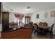 Living and dining area with leather furniture and hardwood floors at 7878 Tanbier Dr, Orlando, FL 32818