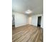 Bright bedroom with wood-look flooring and access to bathroom at 9115 Se 88Th St, Ocala, FL 34472