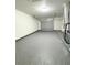 Clean and spacious garage with epoxy flooring and extra storage at 9115 Se 88Th St, Ocala, FL 34472