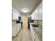 Modern kitchen with white cabinets, granite countertops, and stainless steel appliances at 9115 Se 88Th St, Ocala, FL 34472