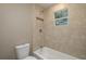Updated bathroom with tile shower and bathtub at 13 E 8Th St, Frostproof, FL 33843