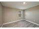 Spacious bedroom with neutral walls and wood-look floors at 13 E 8Th St, Frostproof, FL 33843
