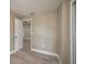 Spacious bedroom with neutral walls and wood-look floors at 13 E 8Th St, Frostproof, FL 33843