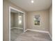 Bedroom with mirrored closet and wood-look floors at 13 E 8Th St, Frostproof, FL 33843