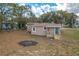 Newly renovated house with teal front door, and a porch at 13 E 8Th St, Frostproof, FL 33843