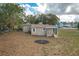 Newly renovated house with teal front door, and a porch at 13 E 8Th St, Frostproof, FL 33843