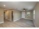 Living Room with light gray walls and vinyl wood flooring at 13 E 8Th St, Frostproof, FL 33843