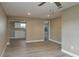 Bright living room with neutral walls and wood-look floors at 13 E 8Th St, Frostproof, FL 33843