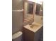 Bathroom with sink, vanity, and mirror at 6274 Whispering Way # 130, Orlando, FL 32807