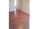 Bedroom with mirrored closet and wood-look flooring at 6274 Whispering Way # 130, Orlando, FL 32807