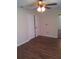 Bedroom with double doors and wood-look flooring at 6274 Whispering Way # 130, Orlando, FL 32807